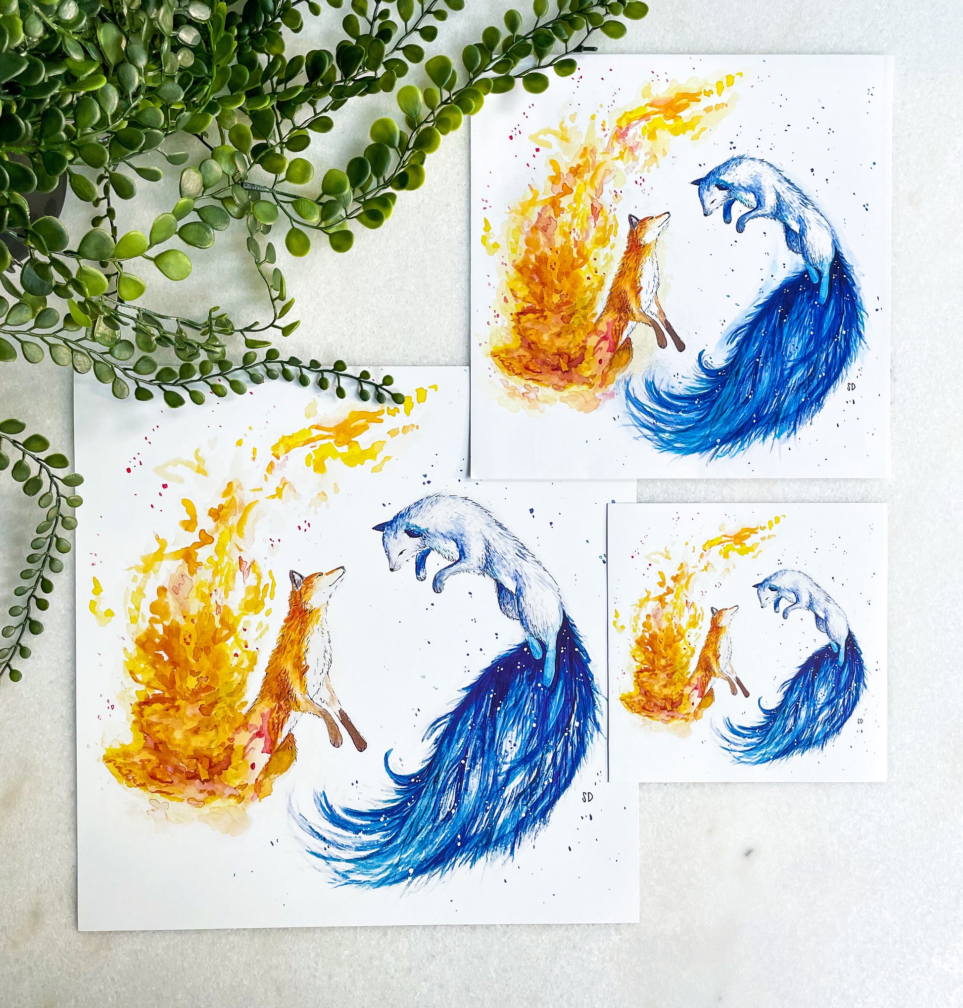 Three different size options for the fire and ice fox watercolor painting art print. Each print is made on high-quality, 100 pound, glossy paper and displays excellent color vibrancy.