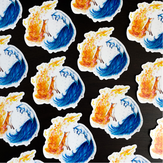 A close-up image of the waterproof, vinyl, dye-cut sticker depicting a watercolor painting from the Wild Planet Creations wild animal collection of fire and ice foxes.