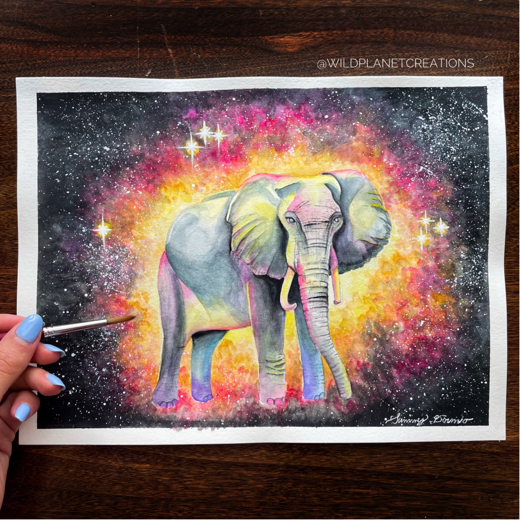 This image displays the original watercolor painting of an African savanna elephant from the Wild Planet Creations collection.